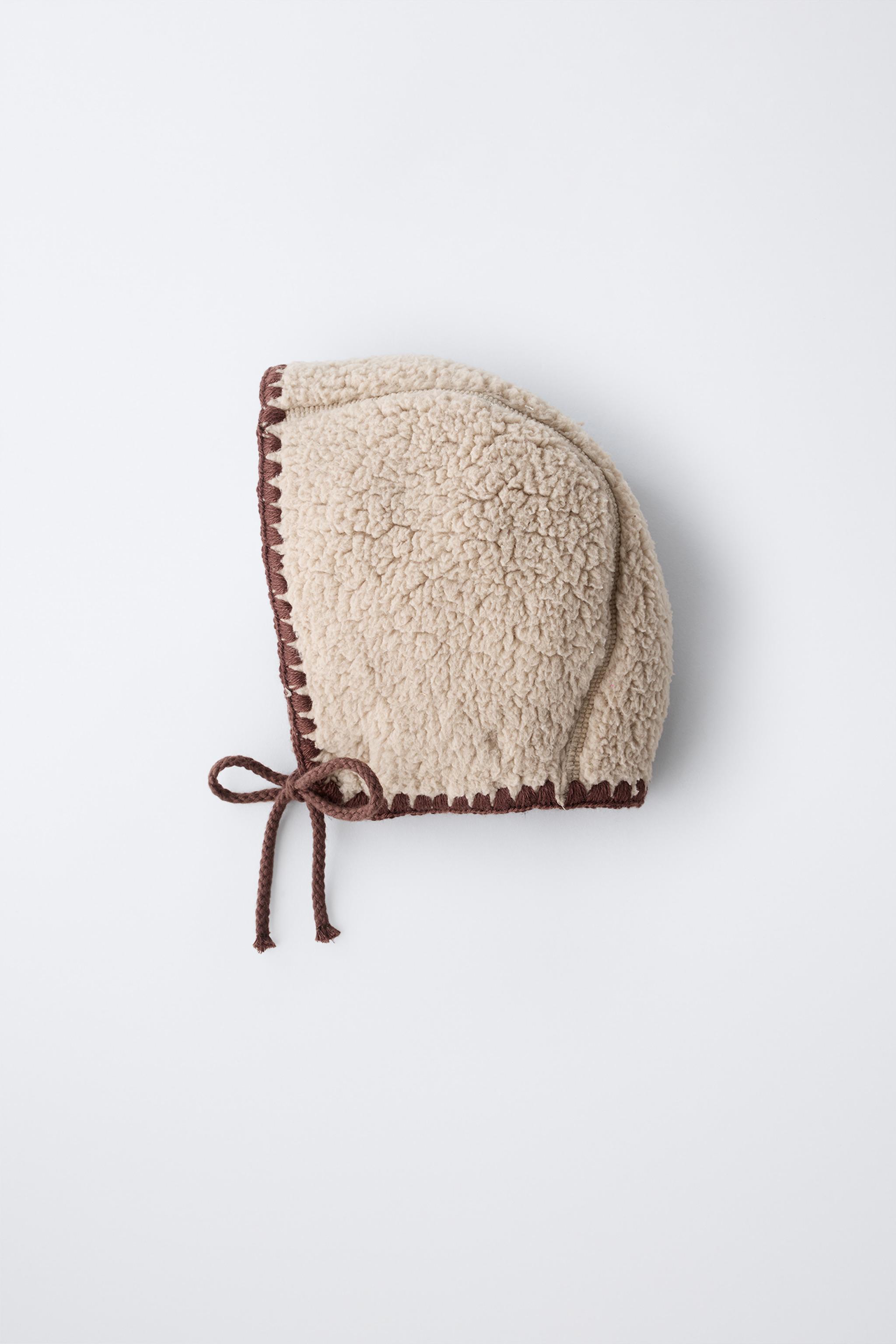 SHEARLING BONNET WITH CONTRAST PIPING